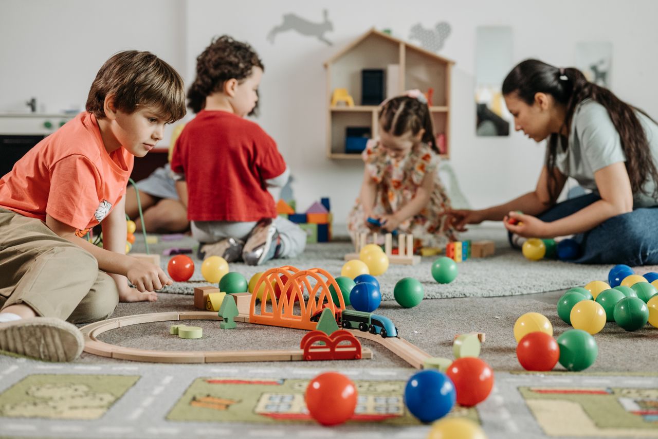 Kids playing with colorful toys in a kindergarten setting, fostering creativity and teamwork.